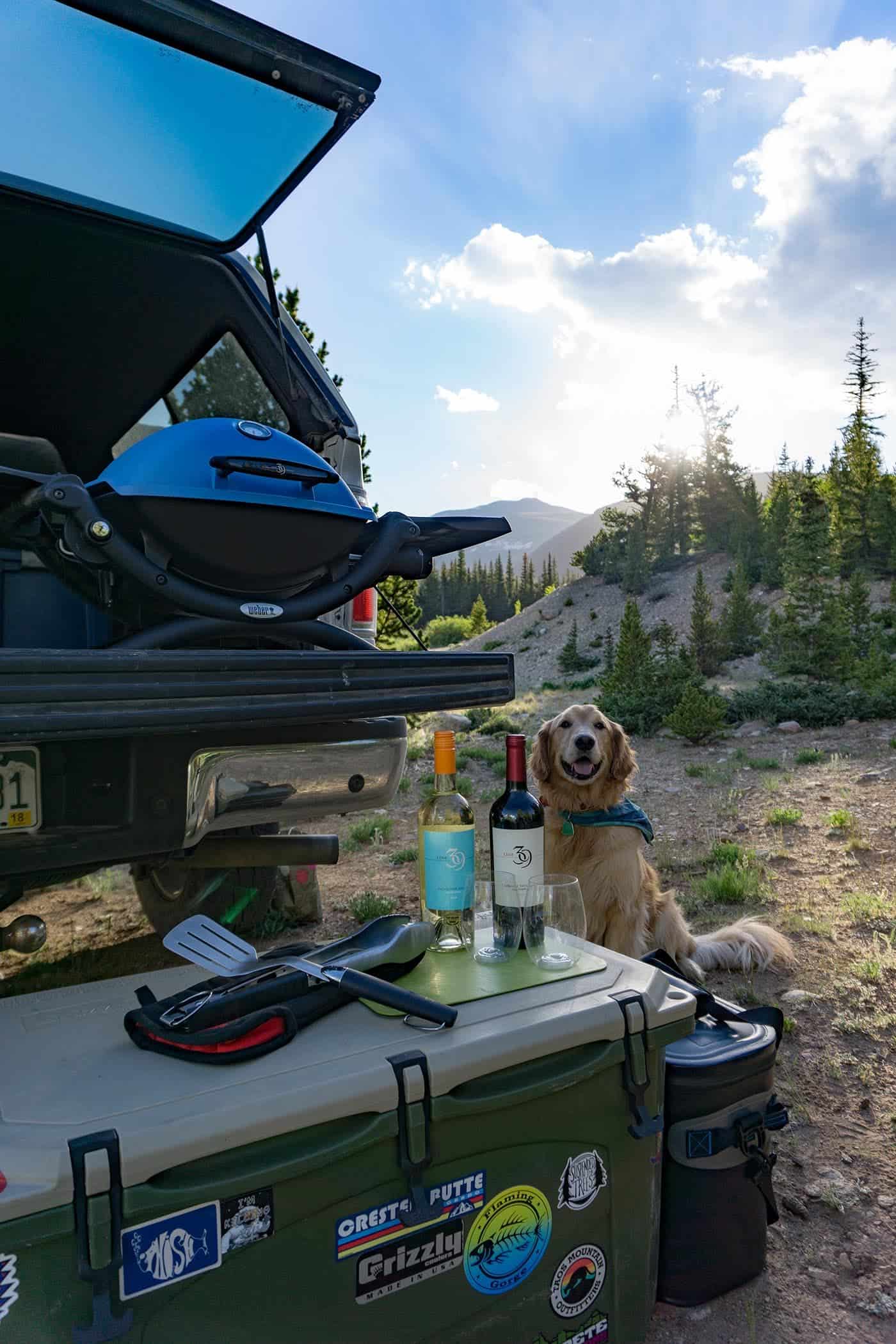 Four tips for car camping in comfort – Campsite with a view, Air mattress for a good night sleep, Line 39 wine and cheese for happy hour and a Weber® Grill for cooking dinner AD Msg 4 21+