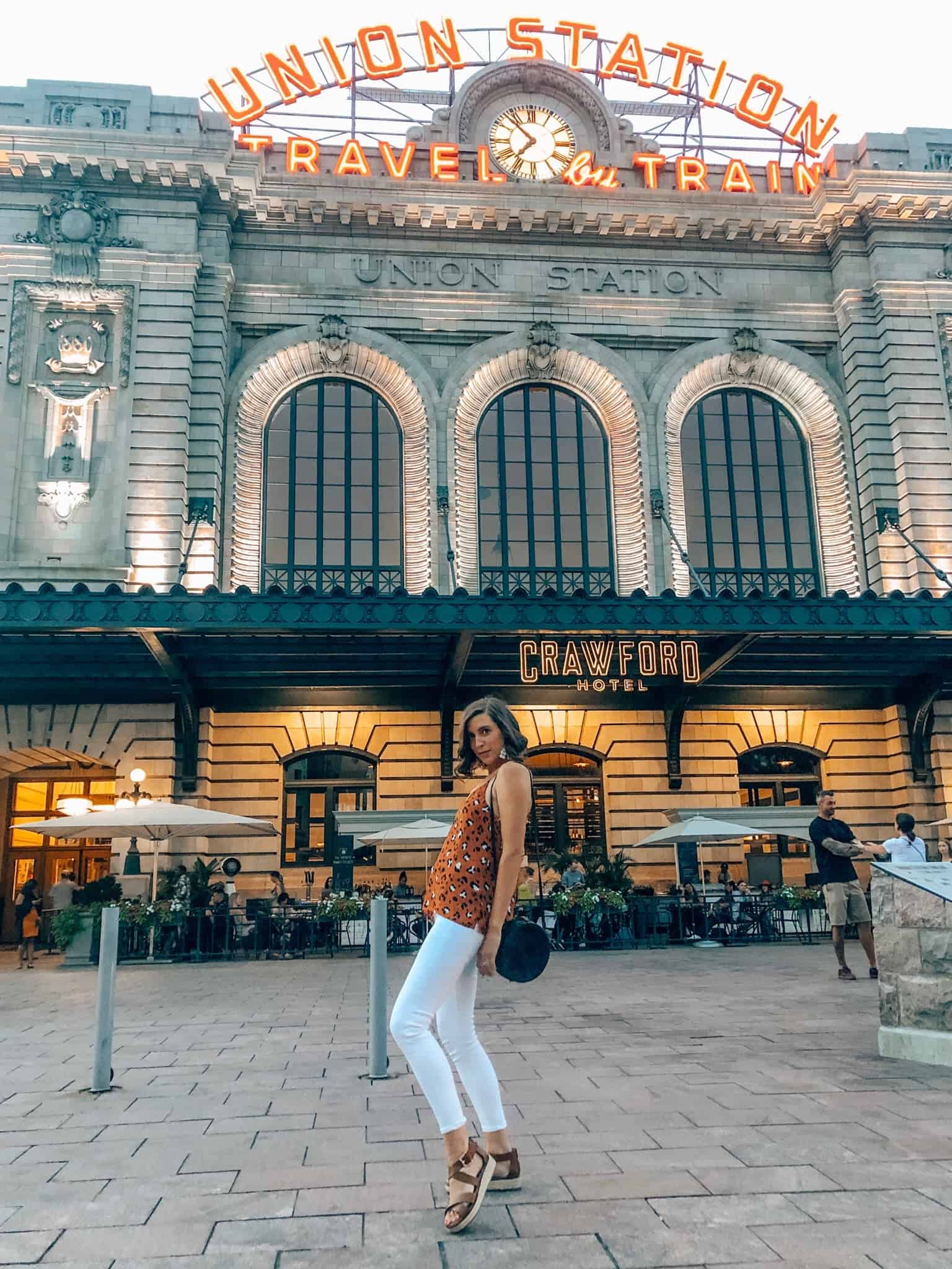 Evereve animal print tank and white pants outside of Denver's Union Station